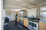 Renovated kitchen with modern, stainless steel appliances